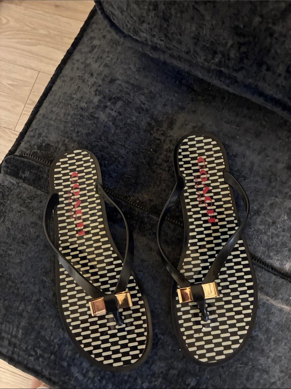 Coach Black Flip Flop Sandals with Gold Bow Accent